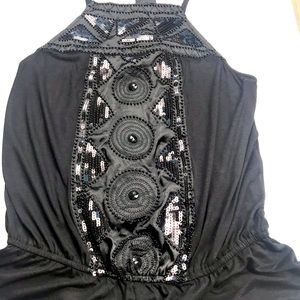 Black sleeveless peplum top
